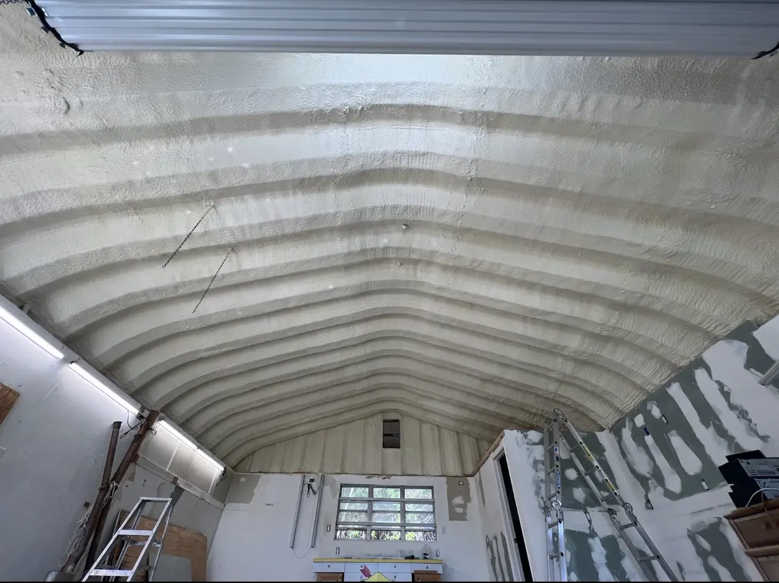 Spray polyurethane foam applied to the underside of a metal roof deck in Truth or Consequences